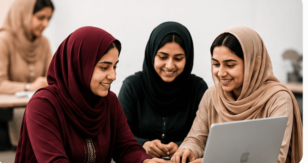 Women learning collaboratively around a laptop