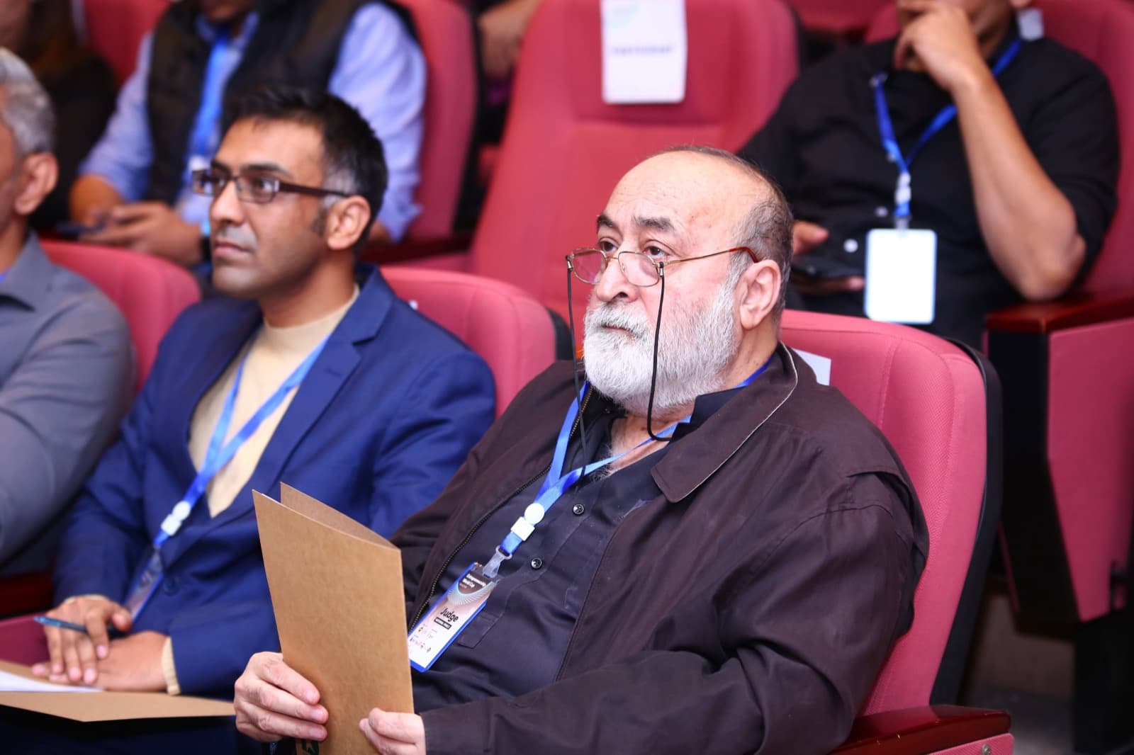 Faisal Sherjan scoring startup pitches at the Entrepreneurship World Cup Pakistan National Finals