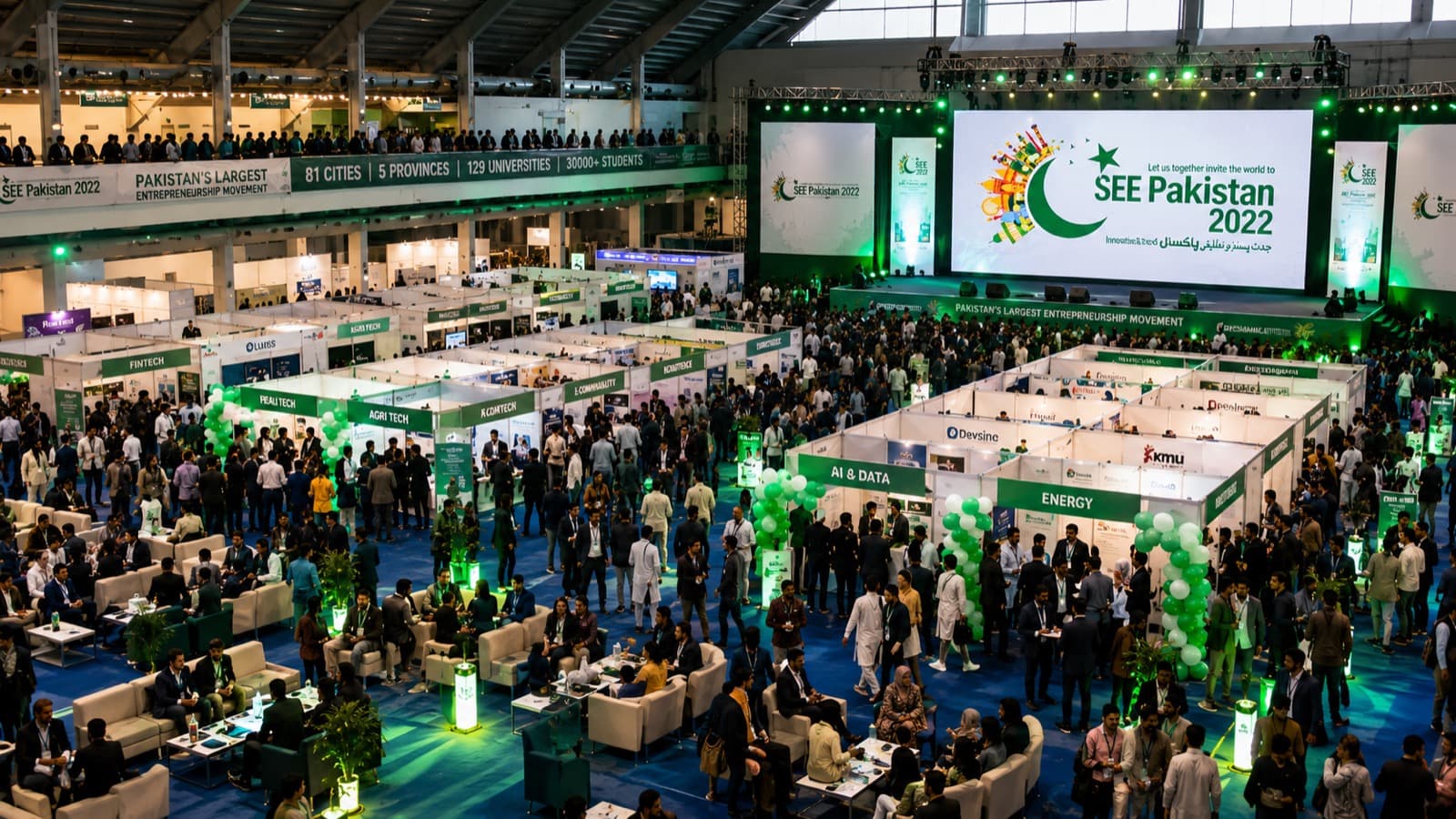 The SEE Pakistan 2022 expo hall — sector-themed startup stalls and a large crowd under the "Pakistan's Largest Entrepreneurship Movement" banners