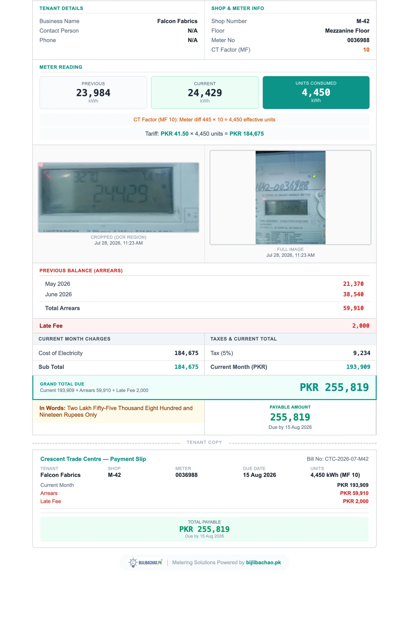 A one-page A4 electricity bill produced by the TenantBill generator. It shows the tenant and shop details, a CT multiplying factor of ten, the previous reading of 23,984 and current reading of 24,429 with 4,450 units consumed, and the factor arithmetic printed in full. Two photographs of the meter are embedded — a cropped view of the display and the full meter face — both timestamped. Below them a previous-balance section lists two carried months and a late fee, followed by the current month's charges, tax, a grand total, the amount written out in words in the Lakh convention, and a tear-off tenant payment slip.