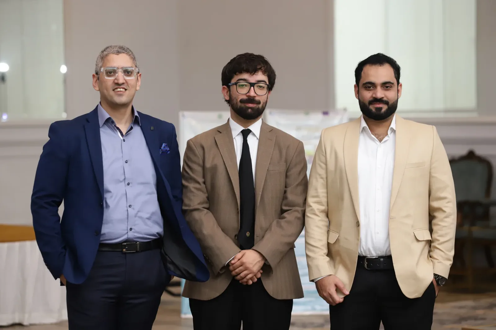 Ali Ahmed with his Digitara colleagues at the UNIDO PAIDAR founder event in Lahore, standing in the hall at The Nishat Hotel.